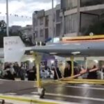 Iran paraded Shahed-136 drones through Tehran in major rallies supporting its armed forces. The display comes as the regime faces a U.S. naval blockade and continued military pressure, signaling resilience and asymmetric warfare capabilities