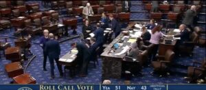 The U.S. Senate floor is captured during the official roll call vote to confirm Kevin Warsh to the Federal Reserve Board of Governors on May 12, 2026. The 51-43 tally displayed in image_10.png marks a successful confirmation, clearing the primary hurdle for Warsh to succeed Jerome Powell as Chair of the Federal Reserve later this week. Photo: Senate Television via C-SPAN
