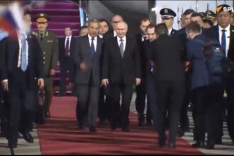 Strategic Calibration: Russian President Vladimir Putin is greeted by Chinese Foreign Minister Wang Yi upon landing in Beijing on May 19, 2026, in image_26.png. The two-day visit is timed to mark the 25th anniversary of the 2001 Sino-Russian Treaty of Friendship and the official launch of the China-Russia Years of Education (2026–2027). Coming hot on the heels of the recent Trump-Xi summit, the meeting allows Putin and Xi to project a unified front and reaffirm an economic and strategic partnership that Putin noted has reached an "unprecedented level." Photo: Maxim Shemetov / Reuters