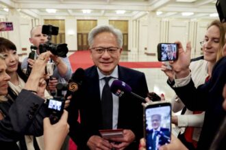 Geopolitical Leverage: In a major escalation of the ongoing chip war, Chinese authorities have added Nvidia’s GeForce RTX 5090D V2 gaming GPU to its official customs banned list. The restriction was strategically handed down precisely while Nvidia CEO Jensen Huang (pictured right in image_28.png) was in Beijing as part of a high-profile trade and diplomatic delegation. The chip was specifically designed by Nvidia with dialed-back specs to legally comply with strict U.S. export controls. However, Beijing's preemptive block signals a refusal to accept downgraded American tech, dealing a severe blow to Nvidia’s multi-billion-dollar consumer market in the region. Graphic: Financial Times / Reuters