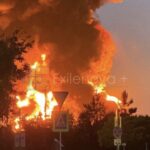 A massive fireball and thick column of dark smoke erupt into the twilight sky following a successful long-range Ukrainian drone strike on a critical Russian oil infrastructure facility. Source: Exilenova+/Telegram via The Kyiv Independent
