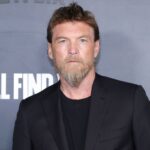 Entertainment: Actor Sam Worthington at Netflix PremiereAustralian actor Sam Worthington—widely recognized for his starring role as Jake Sully in the Avatar franchise—poses for photographers on the red carpet at a Netflix promotional event. *Source: Getty Images / Entertainment Weekly