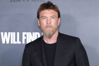 Entertainment: Actor Sam Worthington at Netflix PremiereAustralian actor Sam Worthington—widely recognized for his starring role as Jake Sully in the Avatar franchise—poses for photographers on the red carpet at a Netflix promotional event. *Source: Getty Images / Entertainment Weekly