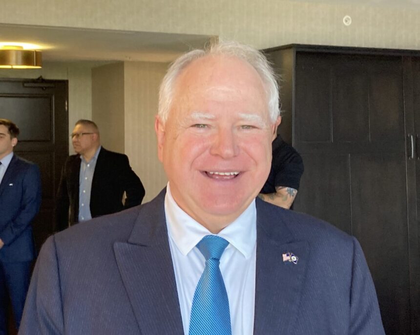 Minnesota Governor Tim Walz smiles during a public appearance. He frequently represents key Democratic legislative initiatives and regional economic developments across the Midwest. Source: National Governors Association / Associated Press Multimedia Archive