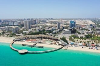 The Avaye Khalij-e Fars cultural complex on Kish Island, Iran, featuring its signature crescent-shaped pier and outdoor coastal amphitheater.
